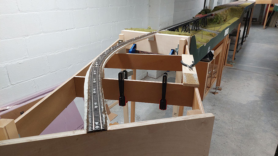 Gluing down track on new single track curve module
