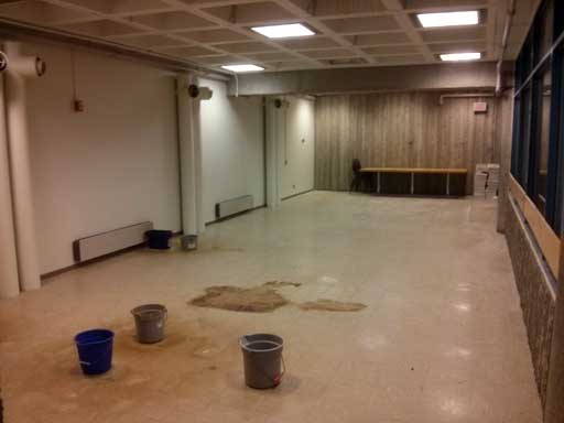 Empty room with buckets